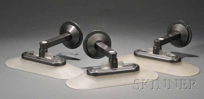 Three Arteluce Patinated Metal and Frosted Glass W: Three Arteluce Patinated Metal and Frosted Glass Wall Sconces, attributed to Arteluce, Italy, mid-20th century, elongated lozenge-shaped shades supported on gunmetal gray patinated metal wall fixtures