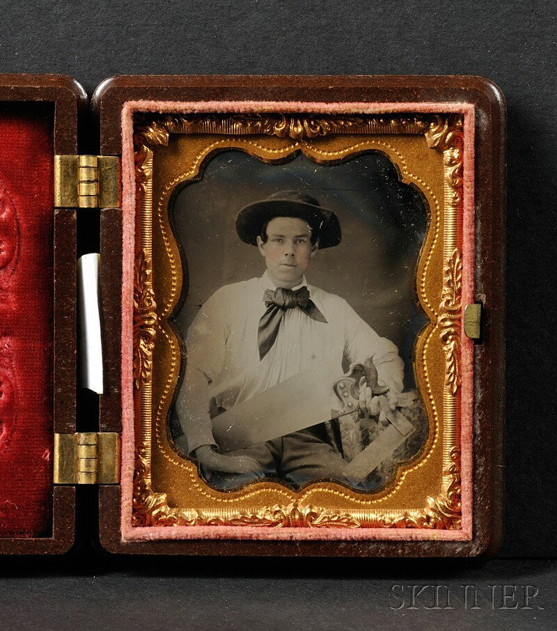 Ninth Plate Tintype Portrait of a Young Carpenter w: Ninth Plate Tintype Portrait of a Young Carpenter with Saw and Square, with hand-tinted cheeks, in a brown, "The Bird Bath" (Krainik 399) Union case, (dark area of emulsion u.r.).