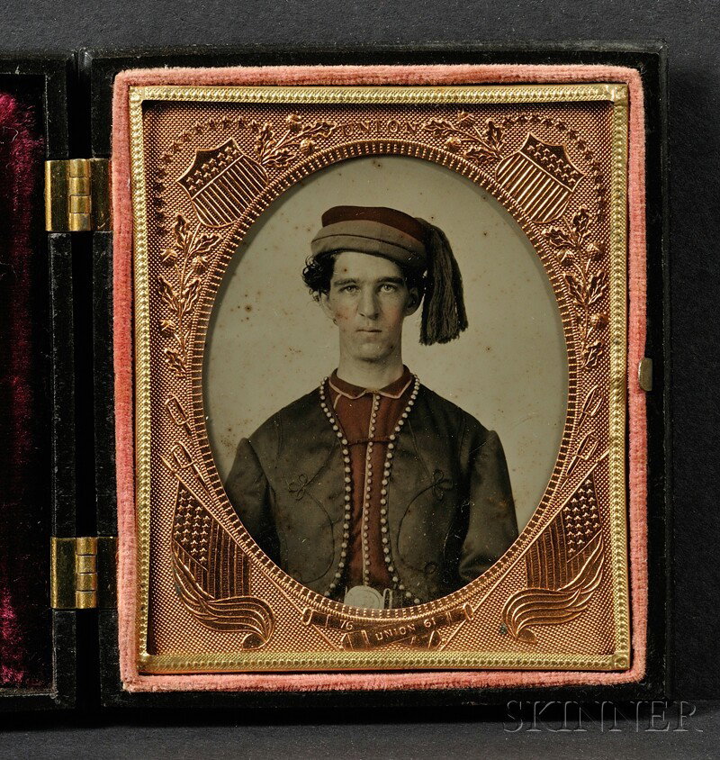 Sixth Plate Ambrotype Portrait of a Union Zouave So: Sixth Plate Ambrotype Portrait of a Union Zouave Soldier, with hand-tinted hat and shirt, in a black "Union and Constitution" and 'The Nesting Birds" (Krainik 110, 168) Union case, (scattered specks o