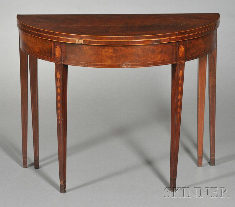 Federal Mahogany Veneer Inlaid Six-legged Demilune: Federal Mahogany Veneer Inlaid Six-legged Demilune Card Table, c. 1795, the top opens to a green felt playing surface, on a conforming apron joining square-tapering legs with patera-inlaid dies with d