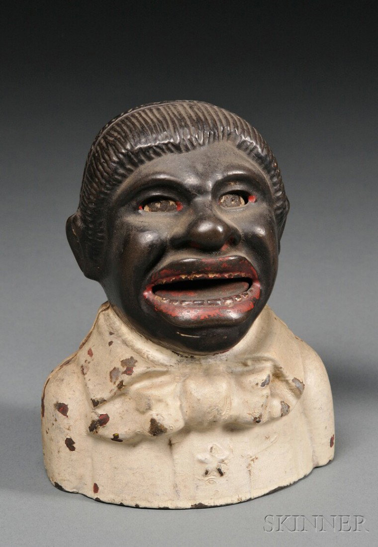 Polychrome Painted Cast Iron Uncle Tom Bank with S: Polychrome Painted Cast Iron Uncle Tom Bank with Star, Kyser & Rex Company, Philadelphia, Pennsylvania, c. 1882, impressed "UT," (paint loss, coat repainted), ht. 5 1/4 in.