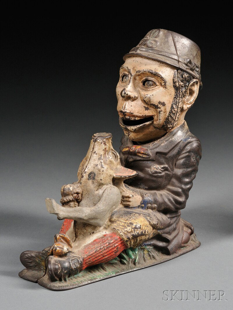 Polychrome Painted Cast Iron "Paddy and the Pig" B: Polychrome Painted Cast Iron "Paddy and the Pig" Bank, J. & E. Stevens Company, Cromwell, Connecticut, c. 1882, manufacturer's patent mark on base, (some paint loss and wear), ht. 8 in.