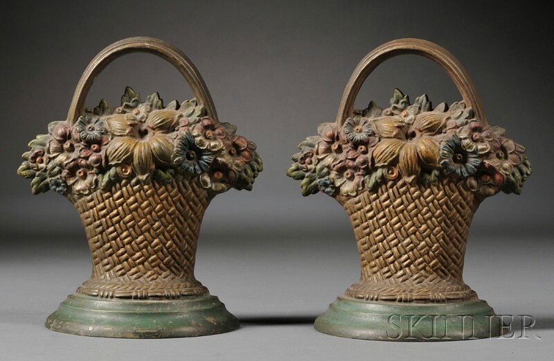 Pair of Polychrome-painted Cast Iron Basket of Flo: Pair of Polychrome-painted Cast Iron Basket of Flowers Doorstops, Bradley & Hubbard, Meriden, Connecticut, late 19th/early 20th century, with rubber bumpers and impressed maker's mark on the reverse,