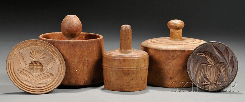 Three Carved Wooden Butter Molds and Three Butter : Three Carved Wooden Butter Molds and Three Butter Stamps, America, 19th century, two-part butter molds depicting a swan, a grazing cow, and a heart-shaped strawberry, the butter molds including an eag