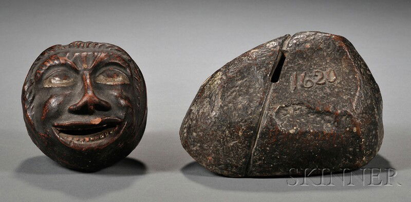 Redware Black Face Bank and Plymouth Rock Bank, Am: Redware Black Face Bank and Plymouth Rock Bank, America, late 19th century, round molded face bank with black and white glaze, together with a bank in the form of the Plymouth Rock with maker's mark i
