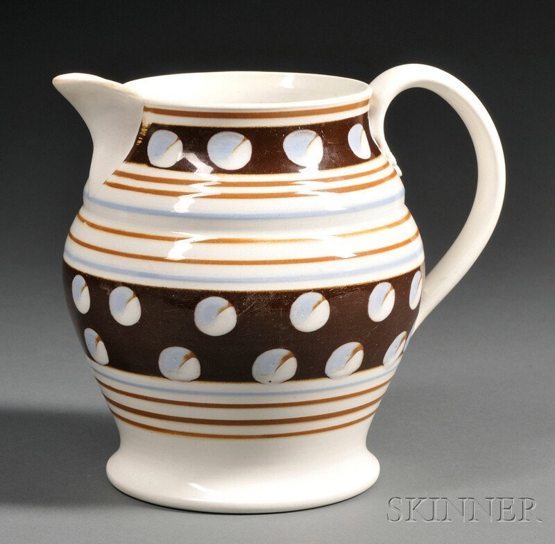 Cat's Eye Decorated Mochaware Pitcher, England, 19: Cat's Eye Decorated Mochaware Pitcher, England, 19th century, baluster-form pitcher decorated with two wide dark brown bands with pale blue and white cat's-eyes, and thin pale blue and brown bands on 