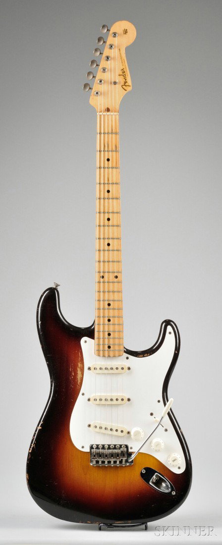American Electric Guitar, Fender Musical Instruments: American Electric Guitar, Fender Musical Instruments, Fullerton, 1958, Model Stratoc aster, serial number 29676 stamped to the neck plate, length of body 15 3/4 in., with original case and strap.