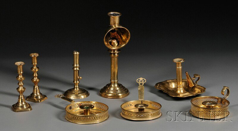 Eight English Brass Lighting Items, 19th century,: Eight English Brass Lighting Items, 19th century, including three chambersticks with pierced gallery, lg. 6 7/8, 9, 10 3/8; a push-up candlestick, ht. 6 5/8; a pair of octagonal base candlesticks, ht.