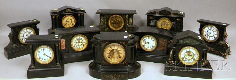 Ten Ansonia Black Mantel Clocks, of various model: Ten Ansonia Black Mantel Clocks, of various models in iron, slate, and ebonized wooden cases, Roman and Arabic numerals, all with eight-day time and strike movements, approx. ht.11 in.