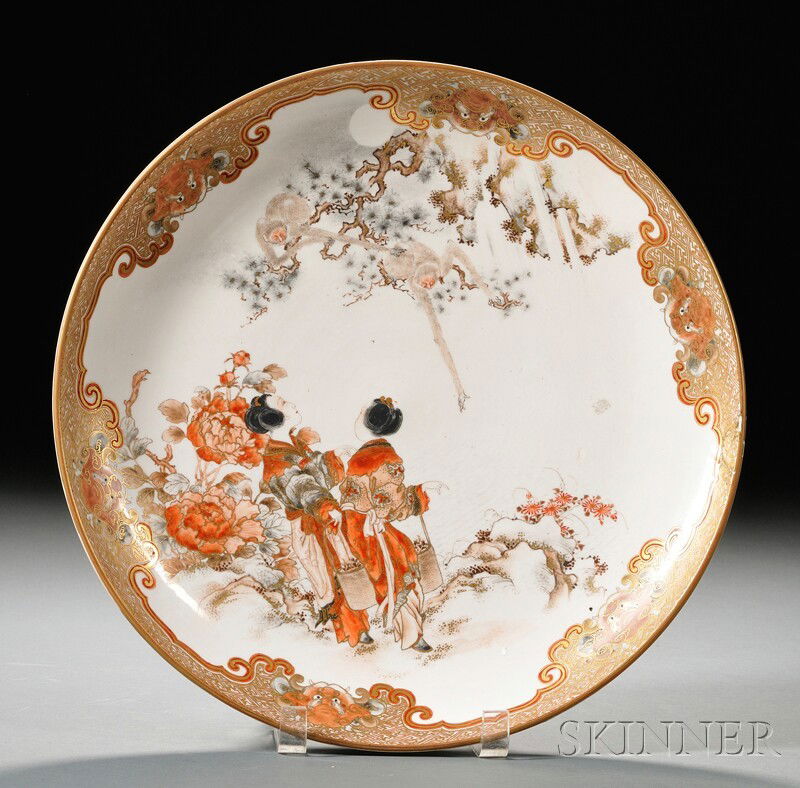 Kutani Bowl, Japan, enameled and gilded decoration: Kutani Bowl, Japan, enameled and gilded decoration in reserve of geisha observing monkeys in pine branches, with shishi heads and key fret border, mark to base, dia. 12 7/8 in.