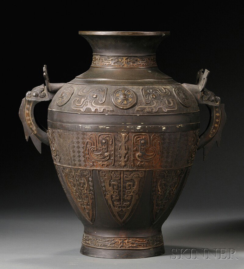 Bronze Vase, China, archaic form, with taotie mask: Bronze Vase, China, archaic form, with taotie masks and k'uei dragons, dragon lugs, ht. 18 in.