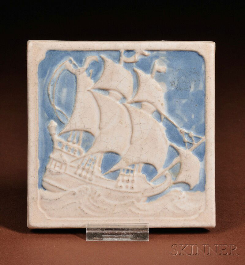 Marblehead Pottery Tile Glazed earthenware Marblehead,: Marblehead Pottery Tile Glazed earthenware Marblehead, Massachusetts Square tile decorated with a white glazed sailboat on a blue glazed ground within a white border, with impressed pottery mark, dia.