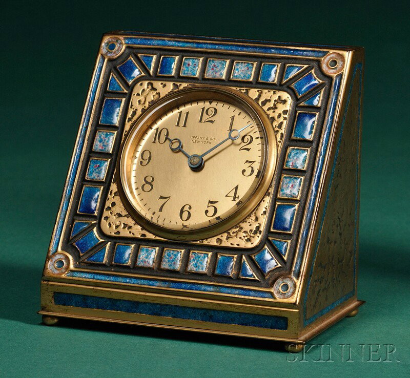 Tiffany Furnaces Desk Clock Blue enamel and brass New York, c. 1924 3-in. dia. brass dial with Arabi: Tiffany Furnaces Desk Clock Blue enamel and brass New York, c. 1924 3-in. dia. brass dial with Arabic numerals and signed Tiffany & Co., New York, easel case with inset enameled decoration and marked 