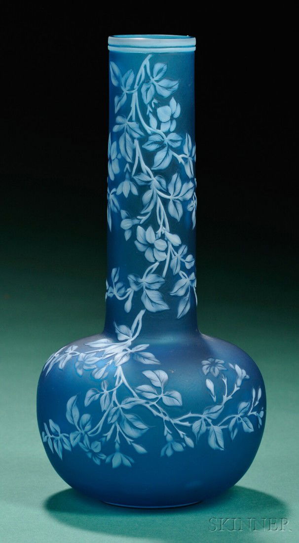 Thomas Webb and Sons Art Nouveau Cameo Glass Vase Art glass Stourbridge, England Cameo-decorated wit: Thomas Webb and Sons Art Nouveau Cameo Glass Vase Art glass Stourbridge, England Cameo-decorated with trailing white flowers and vines on blue ground, ht. 9 in. Provenance: Property of a private New Y