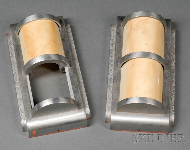 Two Art Deco Wall Sconces Cast metal and resin Rectangular form with half cylinder shades, one missi: Two Art Deco Wall Sconces Cast metal and resin Rectangular form with half cylinder shades, one missing top shade, lg. 10 1/4 in.