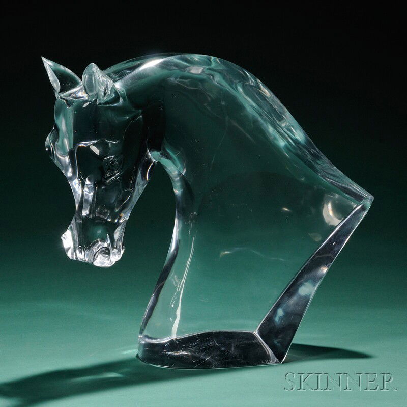 Lalique Tete de Cheval Horse Sculpture Crystal France, c. 1960 Fluid lines of heavy colorless glass : Lalique Tete de Cheval Horse Sculpture Crystal France, c. 1960 Fluid lines of heavy colorless glass in the form of a horse's head looking to his right, marked Lalique on side at base, total ht. 17 3/4
