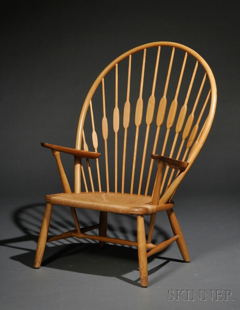 Hans Wegner (1914-2007) Peacock Chair Natural hardwoods and cord Johannes Hansen, Denmark Fan back w: Hans Wegner (1914-2007) Peacock Chair Natural hardwoods and cord Johannes Hansen, Denmark Fan back with shaped slats and arms, with natural cord seat, branded mark, ht. 42 3/4 in.