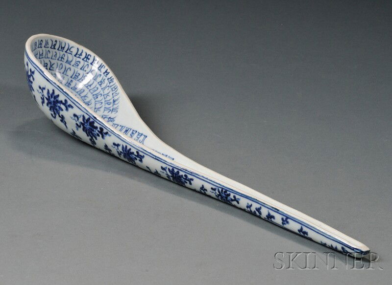 Porcelain Ladle, underglaze blue decoration of flo: Porcelain Ladle, underglaze blue decoration of floral scrolling and Sanskrit characters, Hsuan Te mark, lg. 16 in.