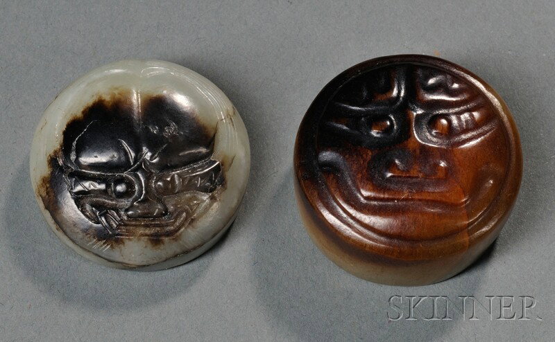 Two Archaic Jade Buttons, China, round shape, carv: Two Archaic Jade Buttons, China, round shape, carved in relief with mythical masks, the stones of russet and celadon color, dia. 1 3/8, 1 1/4 in.