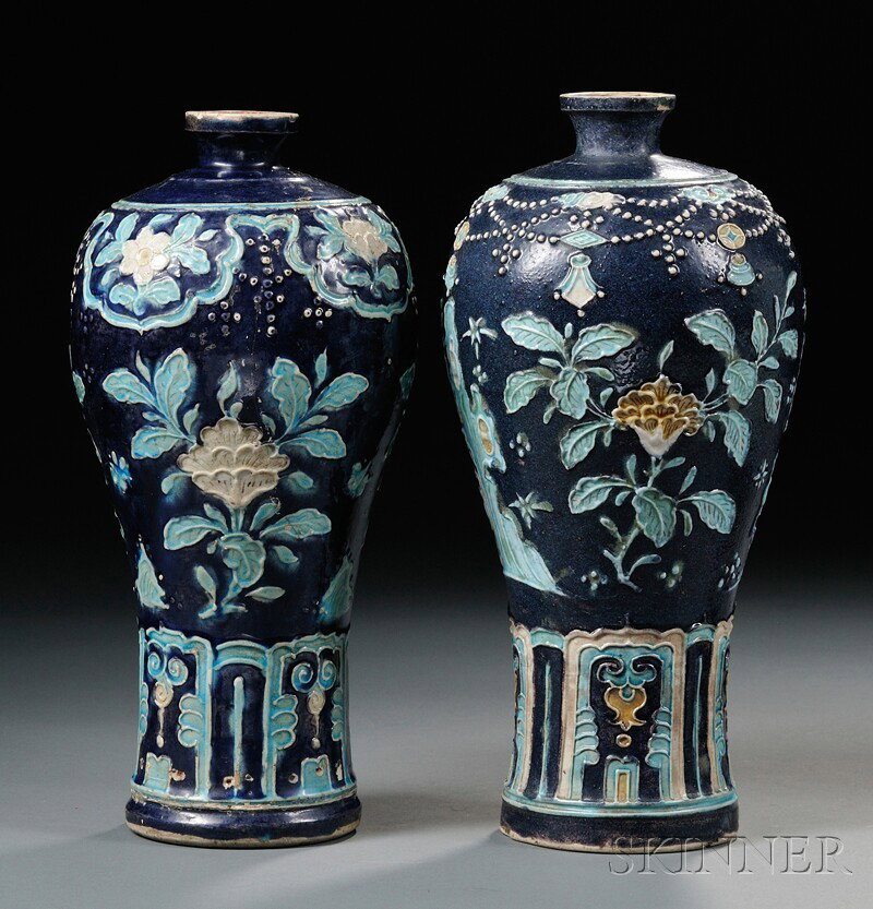 Pair of Fahua-style Meiping Vases, China, each dec: Pair of Fahua-style Meiping Vases, China, each decorated with raised flowers, rocks, and butterflies, with turquoise and straw glazes on deep purple ground, tall lappets around the base,