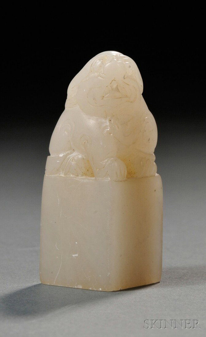 Jade Seal, China, the small rectangular seal surm: Jade Seal, China, the small rectangular seal surmounted by a foo dog finial, the stone of white color, lg. 1 3/4 in.