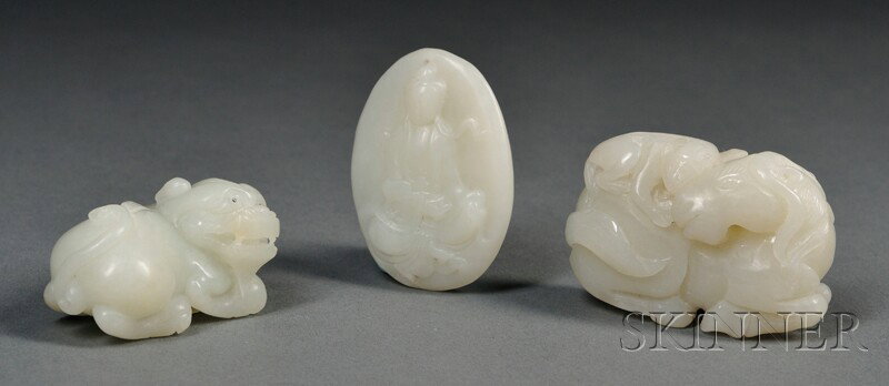 Three Jade Carvings, China, a recumbent foo dog, : Three Jade Carvings, China, a recumbent foo dog, a horse and monkey group, and a plaque with Buddha, the stones of celadon or white color, lg. to 2 in.