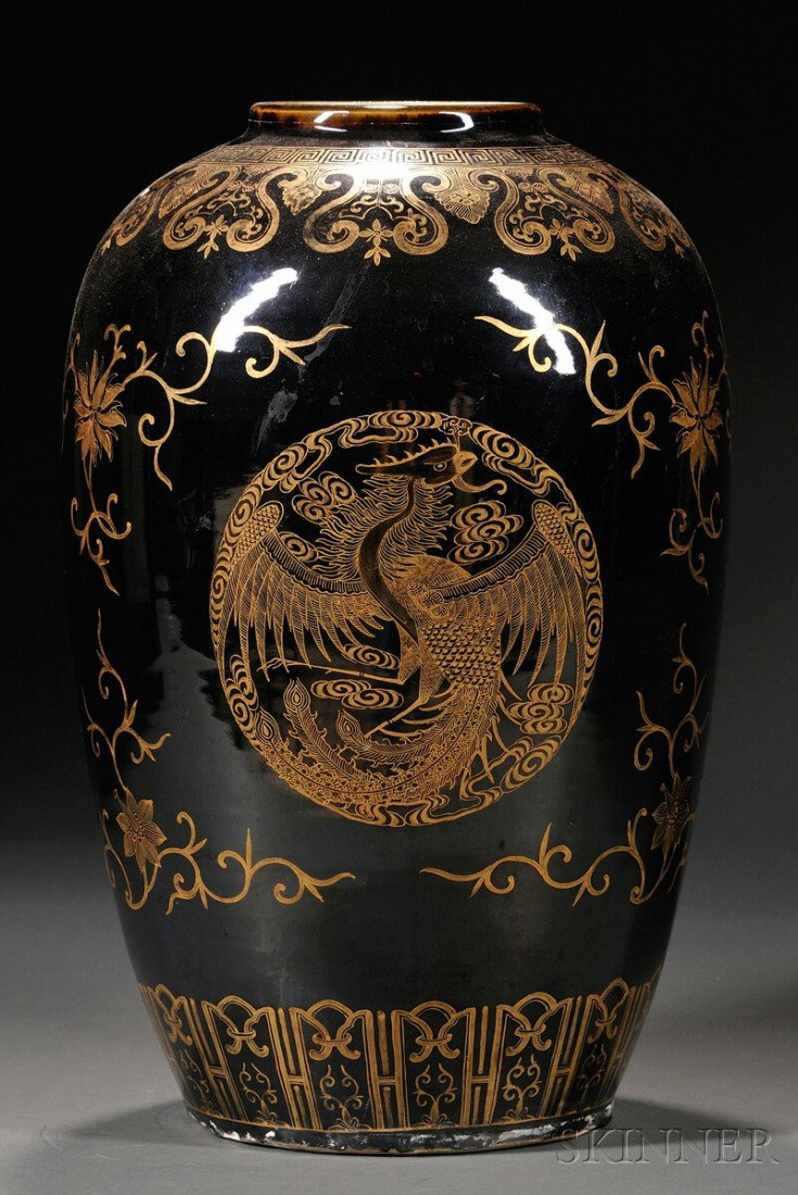 Mirror Black Vase, China, large, ovoid, black gla: Mirror Black Vase, China, large, ovoid, black glaze and gold jar decorated with three phoenix roundels, scrolling lotus with tendrils, and decorative borders at top and base, ht. 15 1/4 in.