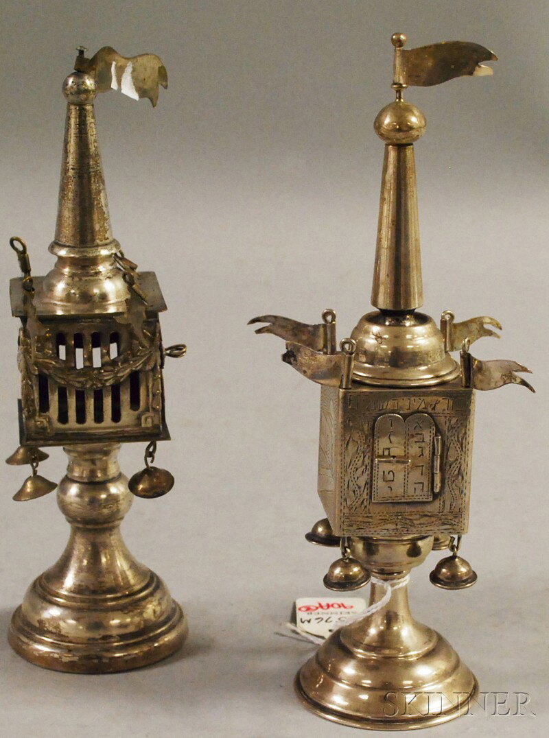 Two Silver-plated Tower-form Besamin Box Spice Con: Two Silver-plated Tower-form Besamin Box Spice Containers, unmarked, likely Israeli, one engraved with buildings, the other cage-form, both set with pennants and hung with bells, on tiered, domed feet