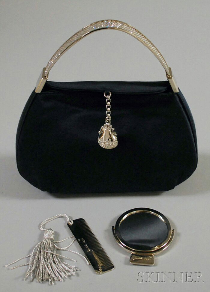 Judith Leiber Navy Blue Satin and Rhinestone Purse: Judith Leiber Navy Blue Satin and Rhinestone Purse, labeled, in original duster, with white metal and rhinestone handle and tassel, coin purse, mirror, and comb inside, mirror and comb signed and in o