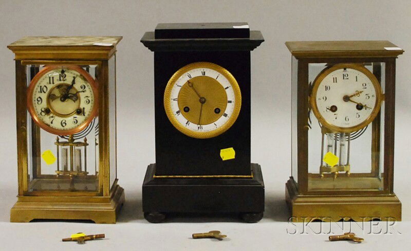 Three Mantel Clocks, including two brass and glass: Three Mantel Clocks, including two brass and glass crystal regulators, a French example with enameled Arabic numeral dial; an American clock with enameled dial and outside escapement; and a French Bel