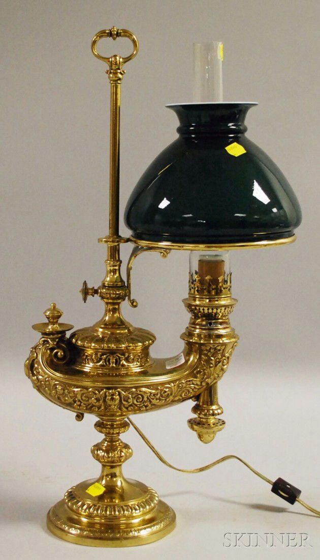 Wild & Wessel Adjustable Brass Aladdin-style Stud: Wild & Wessel Adjustable Brass Aladdin-style Student Lamp with Cased Green Glass Shade, (electrified, probably later shade, some holes from earlier electrification), ht. 22, lg. 11 1/2 in.