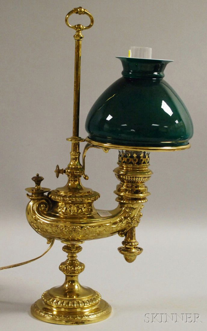 Wild & Wessel Adjustable Brass Aladdin-style Stud: Wild & Wessel Adjustable Brass Aladdin-style Student Lamp with Cased Green Glass Shade, (electrified, some holes from earlier electrification, probably later shade), ht. 22, lg. 11 1/2 in.