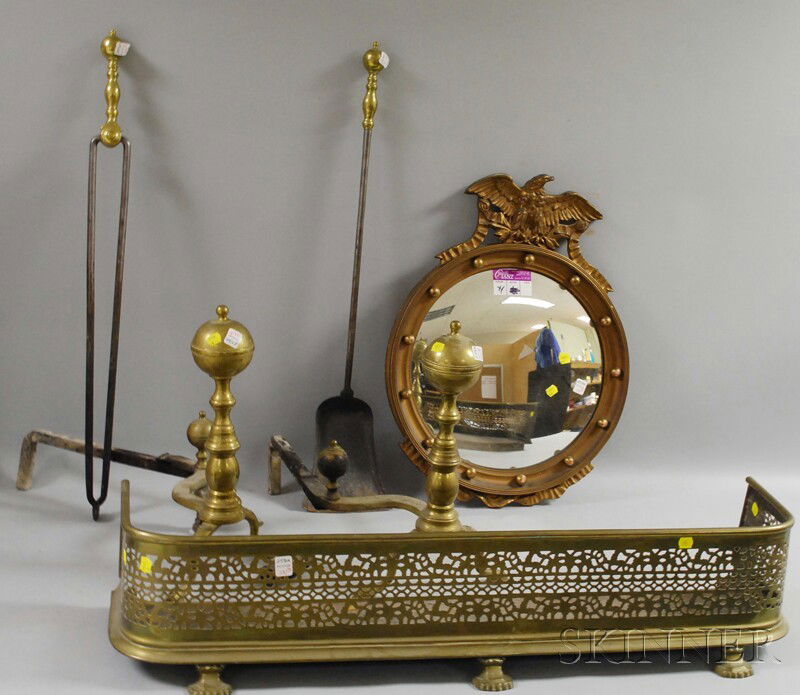 Pair of Brass Belted Ball-top Andirons, a Pair of: Pair of Brass Belted Ball-top Andirons, a Pair of Brass-handled Tools, a Pierced Brass Fireplace Fender, and a Regency-style Gold-painted Girandole Mirror, including tongs and a shovel, (one andiron d