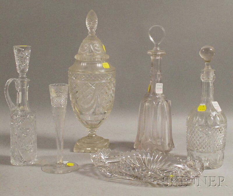 Six Colorless Cut and Molded Glass Table Items, a: Six Colorless Cut and Molded Glass Table Items, a sweetmeat jar with cover, a vase, celery dish, and three decanters.