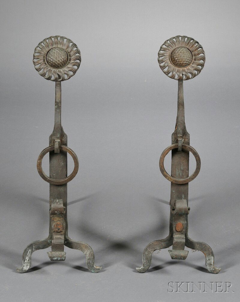 Pair of Wrought Iron Aesthetic Movement Andirons,: Pair of Wrought Iron Aesthetic Movement Andirons, England, third quarter 19th century, with sunflowers above rings and scrolled lappets, ht. 27 3/8 in.