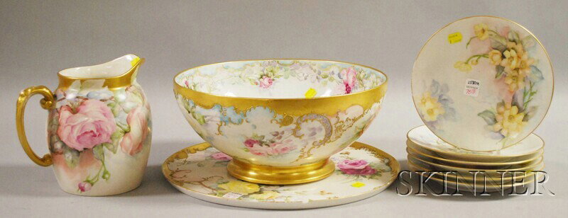Nine Pieces of Hand-painted Floral-decorated Mostly: Nine Pieces of Hand-painted Floral-decorated Mostly Limoges Porcelain Tableware, including six plates, a footed punch bowl, large circular tray, and a pitcher, (punch with some gilt surface abrasions,