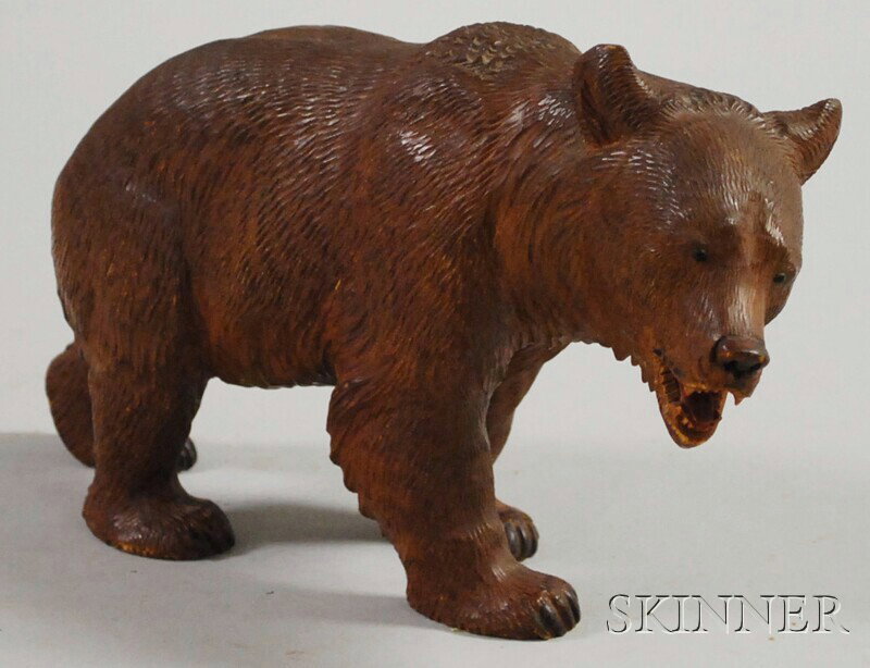 Black Forest Carved Wooden Bear, one paw with inci: Black Forest Carved Wooden Bear, one paw with incised "IX." mark, lg. 11, ht. 5 3/4 in.
