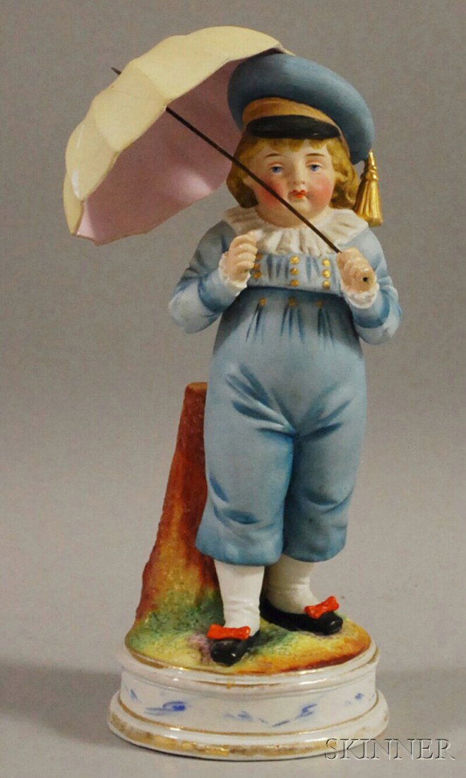 Continental Painted Bisque Porcelain Boy with Umbr: Continental Painted Bisque Porcelain Boy with Umbrella, (umbrella broken and repaired), ht. 10 1/2 in.