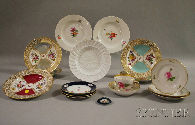 Group of Mostly Meissen Tableware, including a tea: Group of Mostly Meissen Tableware, including a teacup and saucer, three blue-rimmed saucers, five multicolored gilt-decorated plates (losses), a small lid, and a solid white plate with swans, ("X" mar