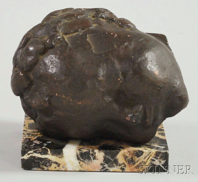 After Constantin Brancusi (Romanian, 1876-1957) Br: After Constantin Brancusi (Romanian, 1876-1957) Bronze Head of a Baby. Impressed "C. Brancusi" on reverse, on marble base, ht. 5, lg. 6 in.