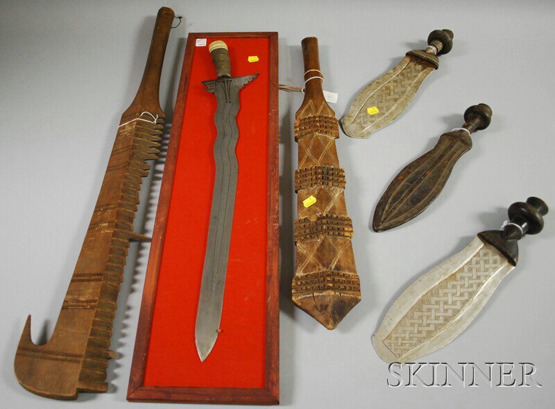 Six Tribal Weapons, including three African knives: Six Tribal Weapons, including three African knives, a kris, and two Melanesian wood clubs.