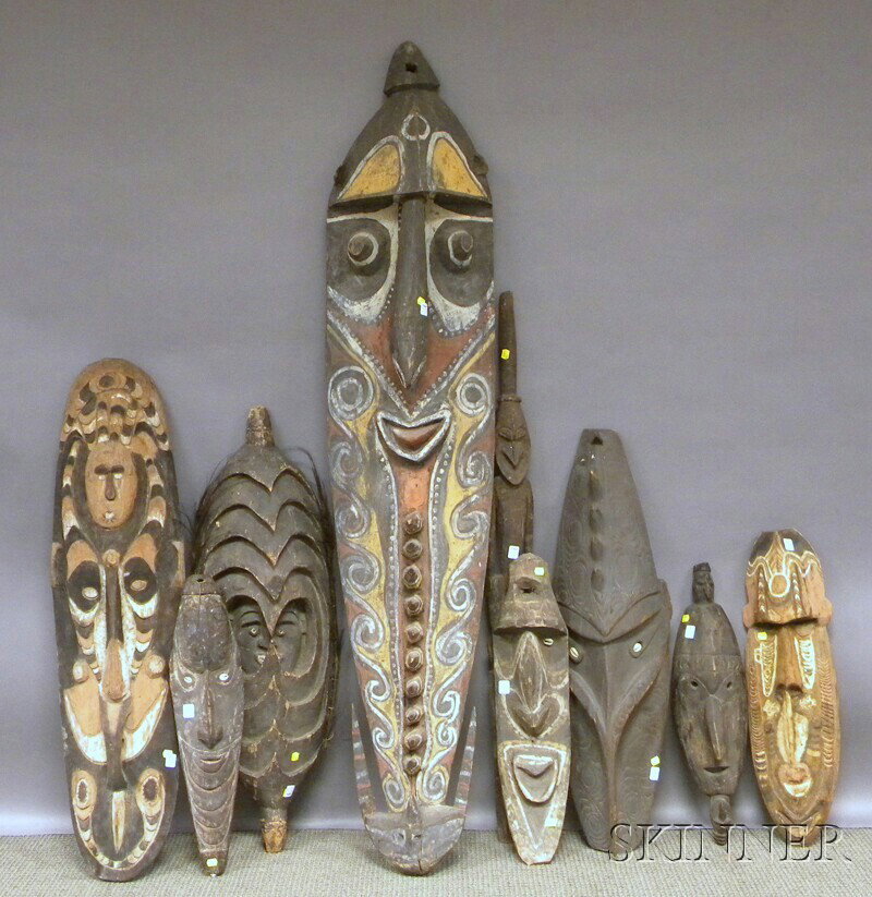 Nine Papua New Guinea Carved Wood Masks and Sculpt: Nine Papua New Guinea Carved Wood Masks and Sculptures. Provenance: From the Collection of Suzanne Lawford. Sold to benefit the Temple Beth Israel and St. James Catholic Church, both of Danielson, Con