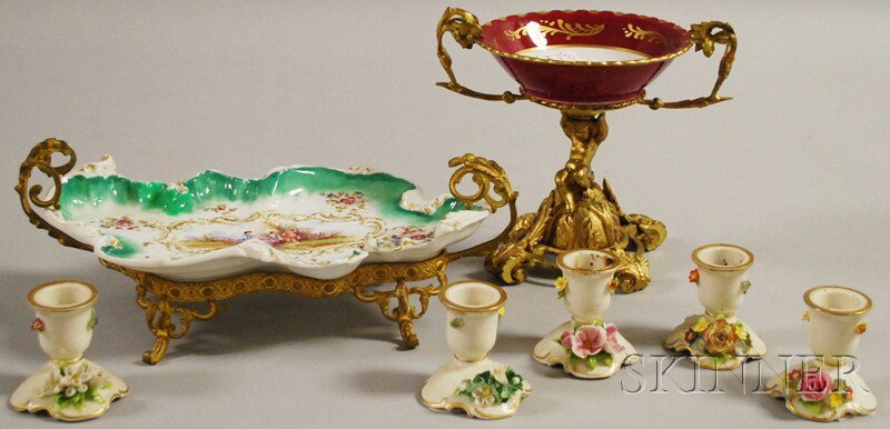 Seven Assorted Continental Gilt-metal and Porcela: Seven Assorted Continental Gilt-metal and Porcelain Table Articles, a French hand-painted porcelain shaped tray on a gilt-metal stand, French Victorian-style compote with gilt-metal base, and a set of