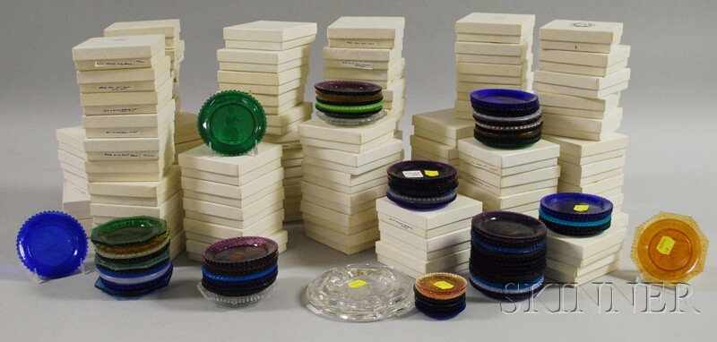 Approximately 157 Pairpoint Sandwich-style Colore: Approximately 157 Pairpoint Sandwich-style Colored and Colorless Pressed Glass Cup Plates, late 20th century, mostly commemorative and souvenir, with boxes and wooden wall display rack.