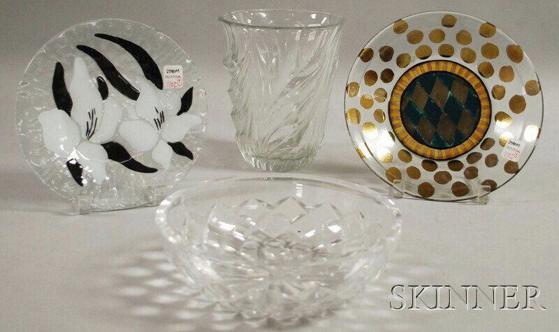 Four Glass Table Items, including one Mackenzie-C: Four Glass Table Items, including one Mackenzie-Childs hand-painted plate, a clear art glass plate with black and white lily design, a colorless glass swirl design vase signed "Val St. Lambert," and a