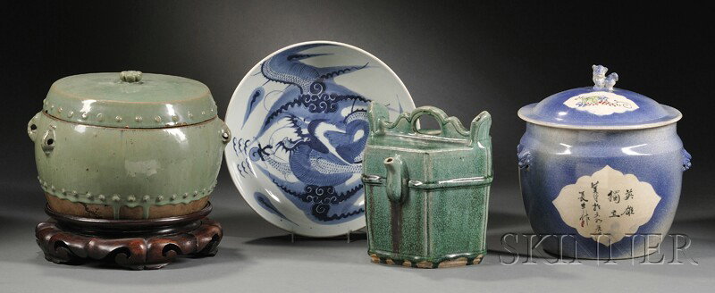Four Ceramic Items, China, two large covered jars,: Four Ceramic Items, China, two large covered jars, one with wood stand, a large blue and white charger with a dragon, and a green glaze a soy pot, ht. to 10 1/4 in.