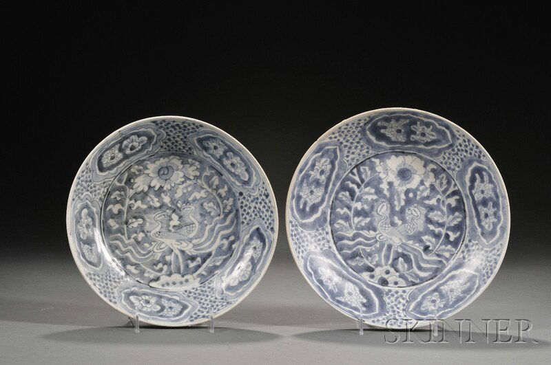 Pair of Blue and White Plates, China, Ming dynasty: Pair of Blue and White Plates, China, Ming dynasty for export to Southeast Asia, underglaze blue decoration of peacocks, flowers, and rocks, (minor chips to rims and hairline cracks), dia. to 11 1/8 i