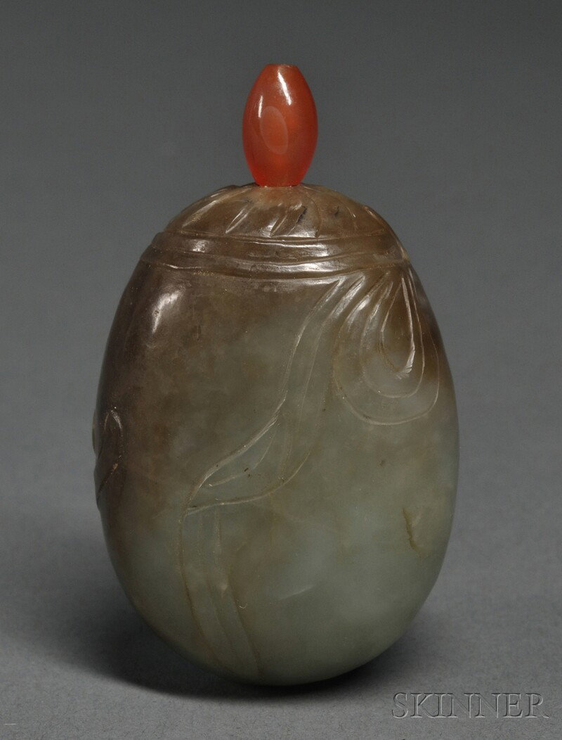 Jade Snuff Bottle, China, 19th century, of pebble: Jade Snuff Bottle, China, 19th century, of pebble shape with incised elephant, carnelian stopper, stone of dark celadon color with dark brown markings, ht. 2 5/8 in.