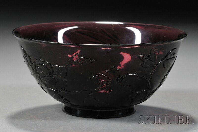 Peking Glass Bowl, China, 20th century, deep bowl: Peking Glass Bowl, China, 20th century, deep bowl of purple color depicting lotus and egrets in relief, dia. 6 3/8 in.