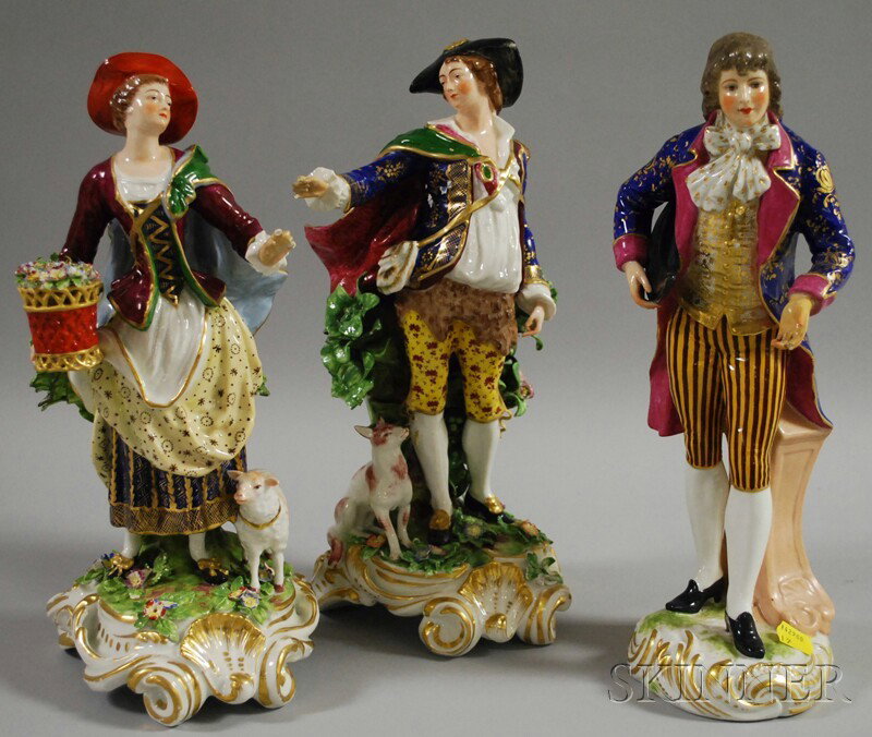 Three Hand-painted Paris Porcelain Figures, a pas: Three Hand-painted Paris Porcelain Figures, a pastoral couple with applied flowers and foliage, he with a dog and she with a sheep and basket of flowers, ht. to 12 5/8; and a gentleman with his hat un